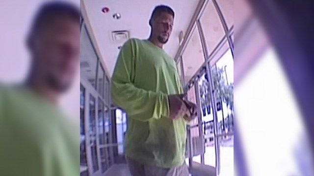 "The unidentified suspect is described as a White or Hispanic male with dark hair and goatee, wearing a bright green long-sleeved shirt and khaki colored shorts or pants," police said. (Source: Avondale Police Department)