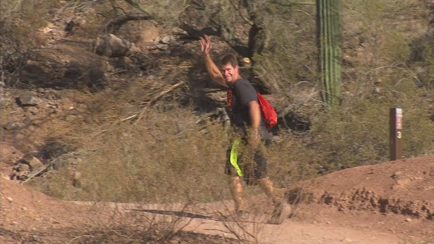Scott Cullymore helps hikers on Camelback Mountain if they need it. (Source: KPHO/KTVK)