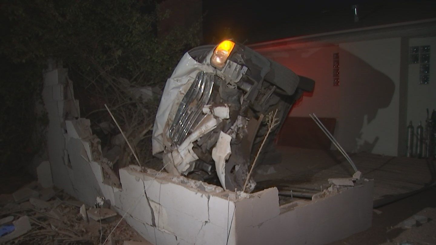 A crossover SUV crashed into a wall after rolling over. A good Samaritan helped out the victims inside. (Source: KPHO/KTVK)