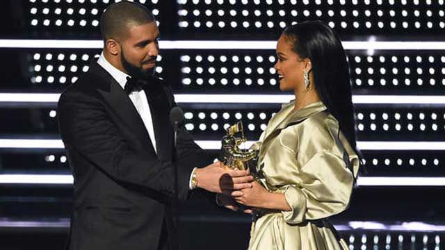 FILE - In this Aug. 28, 2016, file photo, Drake presents the Michael Jackson Video Vanguard Award to Rihanna at the MTV Video Music Awards. (Photo by Charles Sykes/Invision/AP, File)